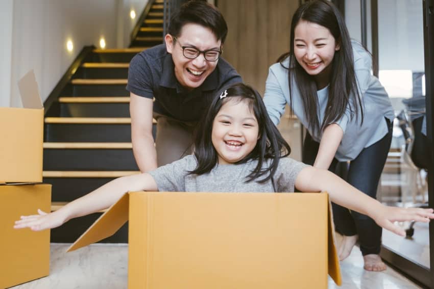 Family together getting ready to move. How To Choose The Right Neighborhood For Your Family