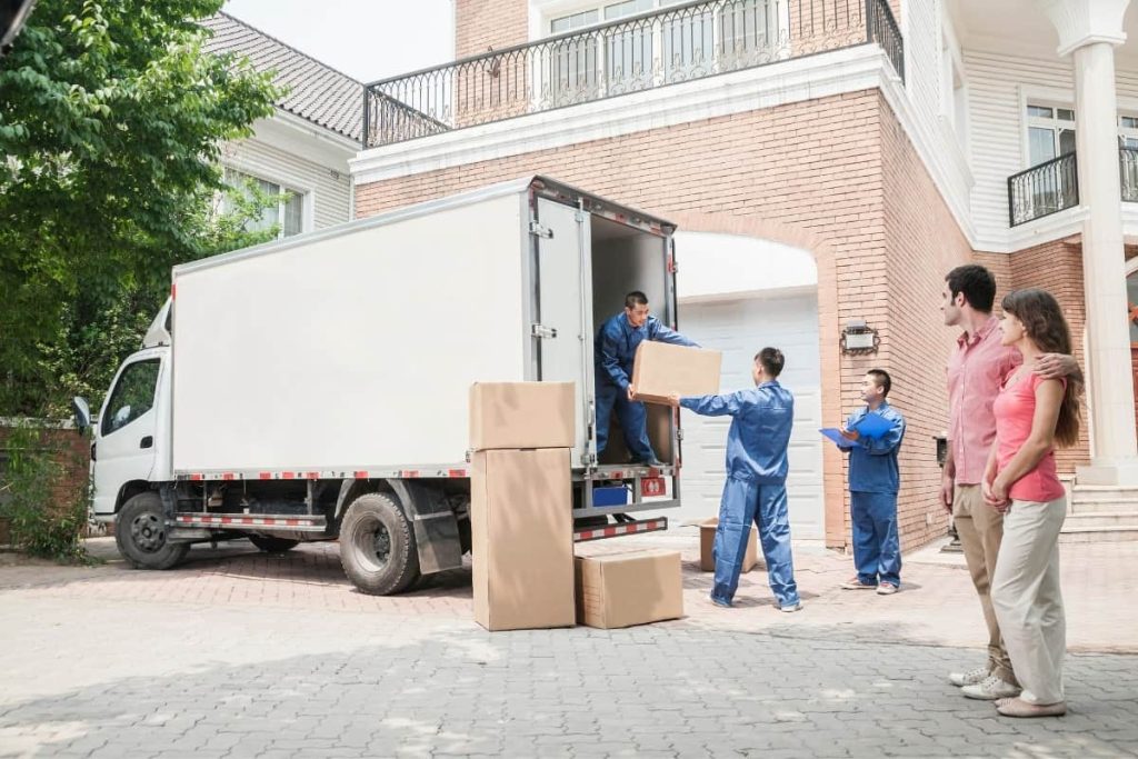 Hired movers packing moving van
