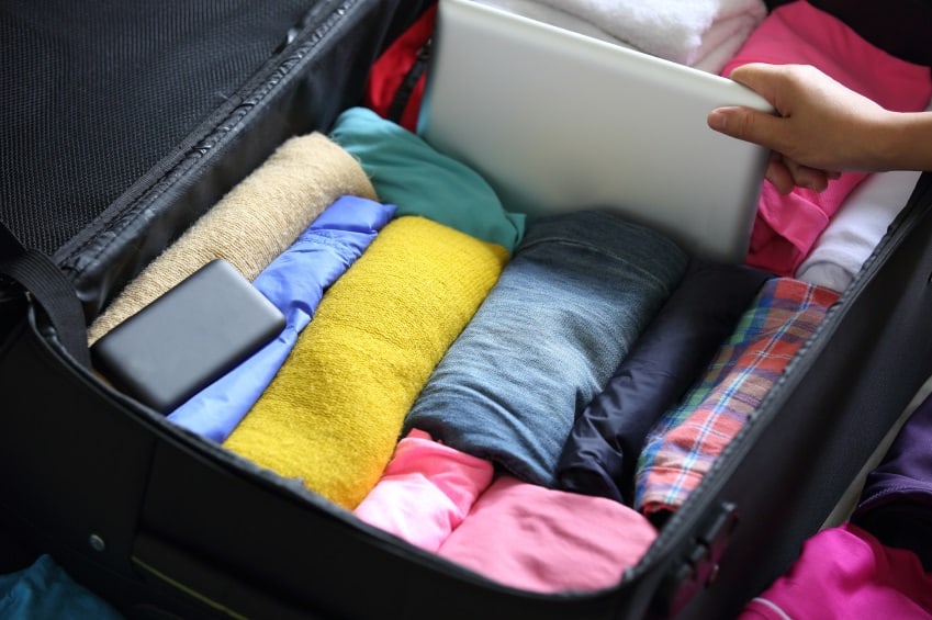 woman packing suitcase